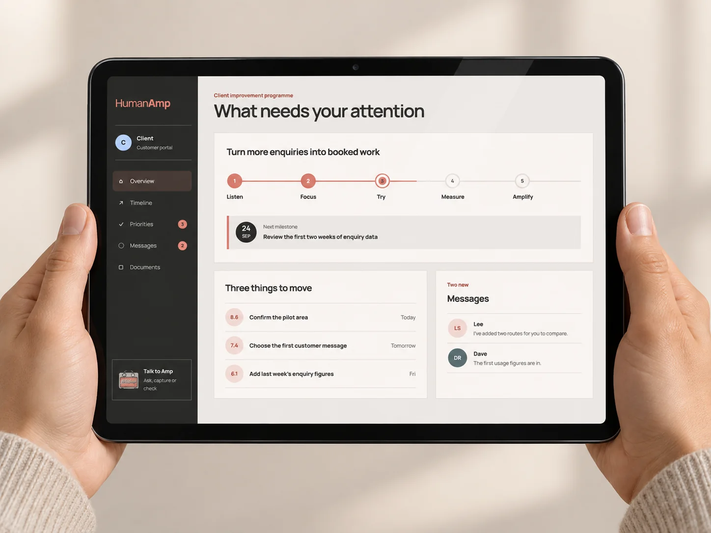 HumanAmp customer portal displayed on an iPad held in two hands